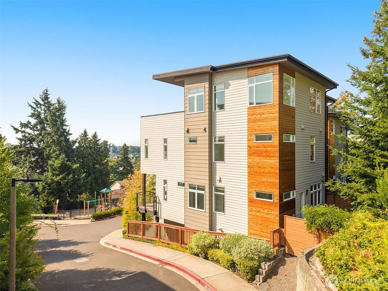 corner townhouse view, wood siding, street view